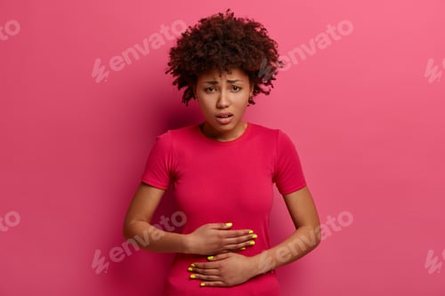 Preview: Unhappy African American Female Feels Unwell, Has Stomach Ache Because Of Food Poisoning, Abdominal