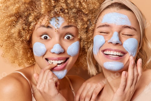 Preview: Headshot Of Positive Pleased Young Women Apply Beauty Masks Smile Toothily Undergo Skin Care