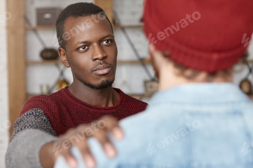 Preview: I'M Always Here For You. Indoor Shot Of Warm-Hearted Young African American Man Showing Compassion