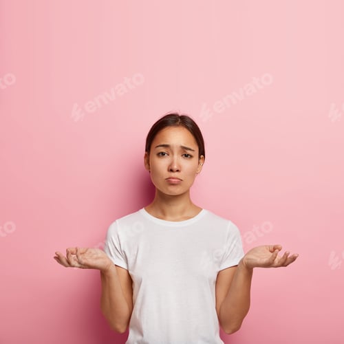 Preview: Attractive Ethnic Woman Spreads Palms With Uncertainty, Has Unhappy Look, Faces Difficult