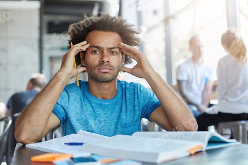 Preview: Handsome Dark-Skinned Bearded Student With Afro Haircut Squeezing Temples, Having Headache While