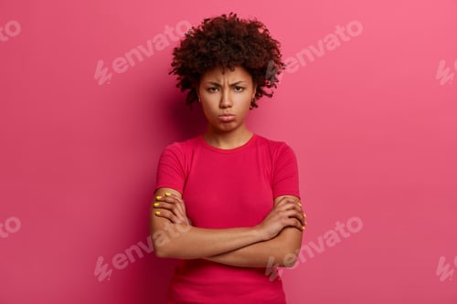 Vista previa: Resentful Unhappy Woman Looks With Sullen Grimace, Crosses Arms Over Body, Discontent With Bad