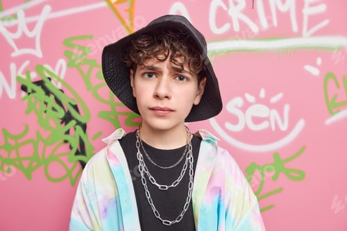 Preview: Handsome Fifteen Years Old Teen Boy Smirks And Looks Displeased At Camera Wears Stylish Clothes