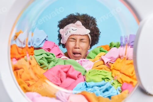 Preview: Frustrated Disappointed Curly Haired Tired Woman Cries From Tiredness Wears Blindfold On Forehead