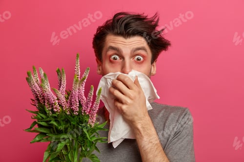 Preview: Man With Allergy Sneezes And Covers Nose With Napkin, Listens Advice From Allergist How To Cure Hay