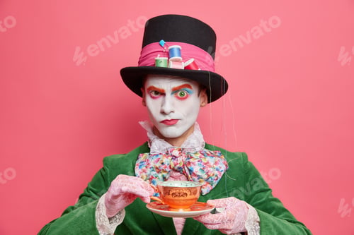 Preview: Serious Male Hatter From Wonderland Drinks Tea On Party Looks Strict At Camera Wears Special