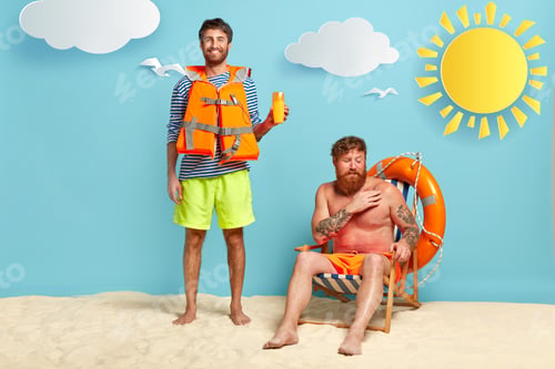 Preview: Full Length Shot Of Happy Male Lifeguard Advertises Sun Screen Or Protection Lotion, Wears