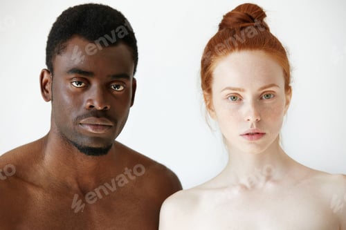 Preview: Black And White. Headshot Of African Man And Caucasian Woman Standing Shirtless And Looking At The