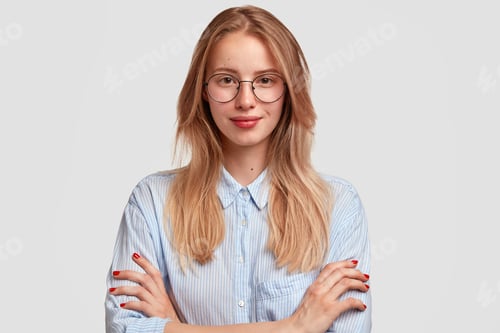 Preview: Studio Shot Of Good Looking Intelligent Female Professor, Doesn`T Have Much Experience, Wears Big