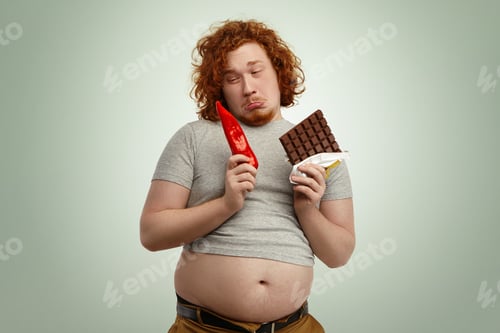Preview: Fustrated Funny Young Redhead Man Wearing Small Grey T-Shirt With His Big Belly Sticking Out