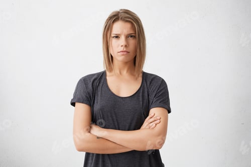 Preview: Waist Up Shot Of Beautiful Irritated Young Woman With Bob Haircut Holding Her Arms Crossed, Having