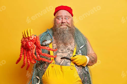 Preview: Funny Blue Eyed Seaman Holds Big Octopus And Smoking Pipe, Leads Seafaring Life, Dressed In Sailor