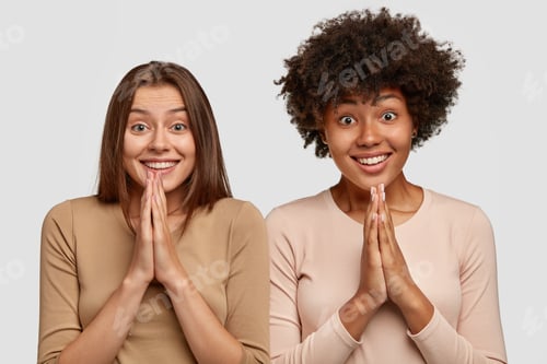 Preview: Two Sisters Have Broad Smiles, Keep Hands In Praying Gesture, Ask For Help, Look Happily At Camera