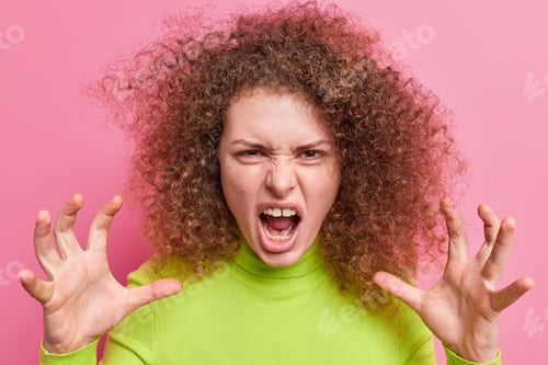 Preview: Portrait Of Angry Woman Frowns Face Exclaims Annoyed Makes Car Claws Keeps Mouth Wide Opened Has