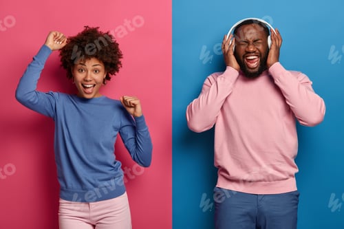 Preview: Feeling Happy And Upbeat. Cheerful Relaxed Afro American Woman Dances Over Pink Background With