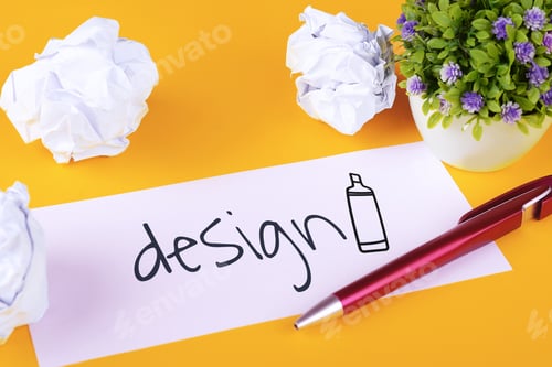 Preview: Paper With "Design" Text And Crumpled Paper Balls On Yellow Background. Brainstorming Concept