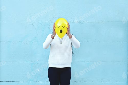 Preview: Young Woman With A Balloon On His Head With Surprised Face In The Street