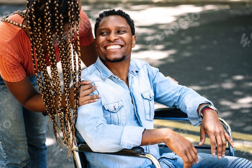 Preview: Man In A Wheelchair Enjoying A Walk With His Girlfriend.
