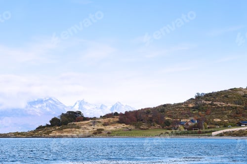 Preview: View Of A River With Mountains At The Back.