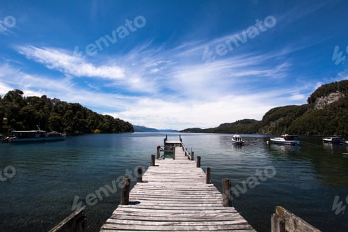 Preview: View Of An Empty Wooden Pier On Lake With Blue Sky On Background.