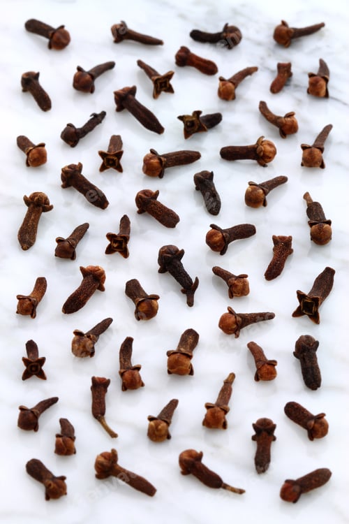 Preview: Beautiful Cloves, Aromatic Flower-Buds, On Carrara Marble Countertop.