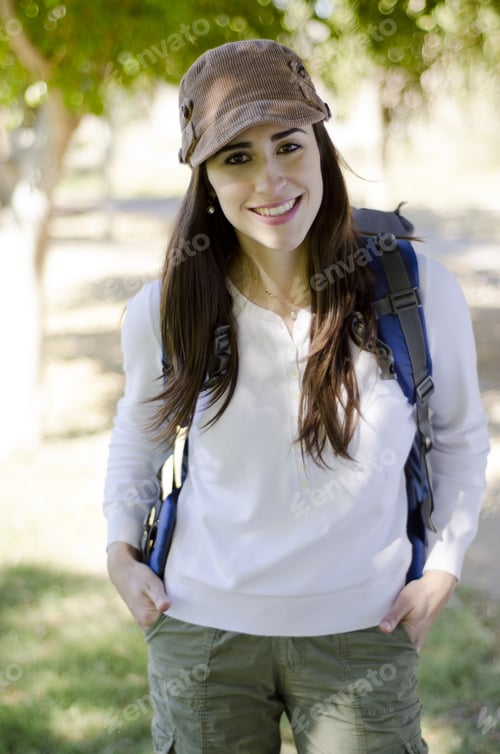Preview: Portrait Of Happy Brunette Smiling On A Hiking Trip