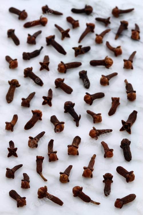 Preview: Beautiful Cloves, Aromatic Flower-Buds, On Carrara Marble Countertop.