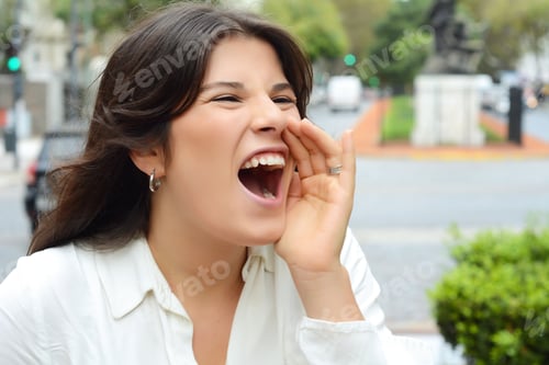 Preview: Portrait Of A Beautiful Young Woman Shouting And Screaming. Outdoors.