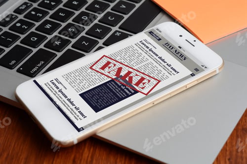 Preview: Close Up View Of Keyboard And Digital Fake News On Smartphone. Propaganda And Disinformation