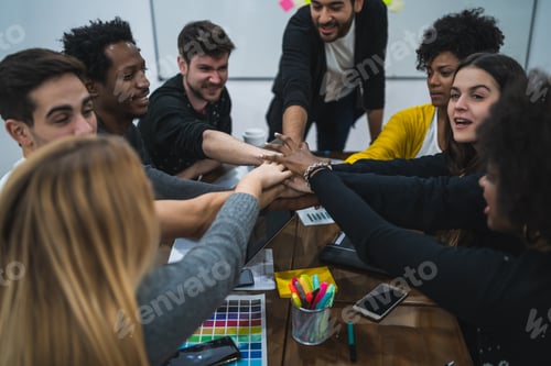 Preview: Team Of Work Showing Unity With Their Hand Together.