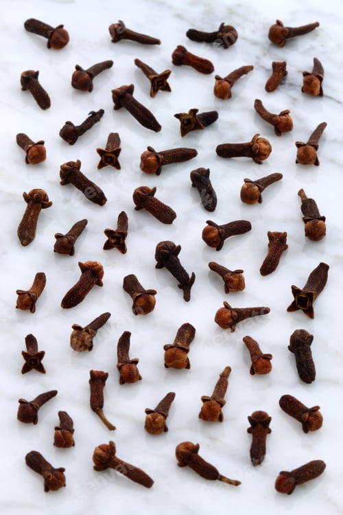 Preview: Beautiful Cloves, Aromatic Flower-Buds, On Carrara Marble Countertop.