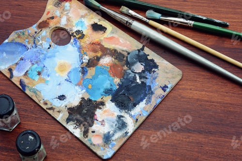 Preview: Artist'S Palette With Colorful Oil Paint Strokes And Paintbrushes On Wooden Background. Art Concept