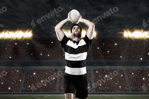 Preview: Rugby Player In A Black Uniform On A Stadium.