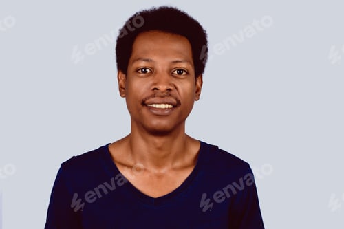Preview: Portrait Of Afro American Man Looking At Camera On Studio.