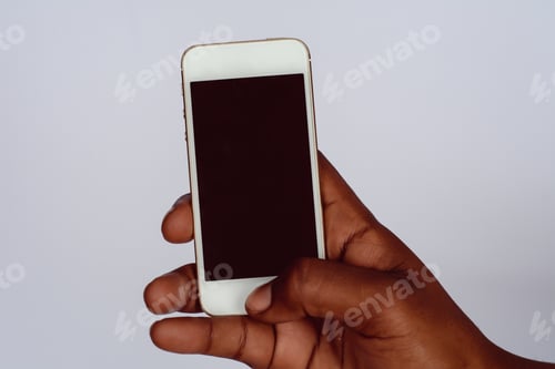 Preview: Male Hand Holding Smartphone With Blank Screen. Isolated On White Background.