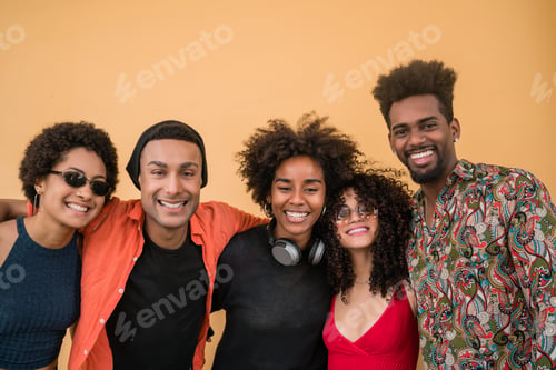 Preview: Portrait Of Afro Friends Having Fun Together And Enjoying Good Time Against Yellow Background