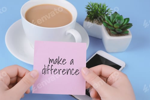 Preview: Paper Card With Text "Make A Difference", Cup Of Coffe And Phone On A Light Blue Background.