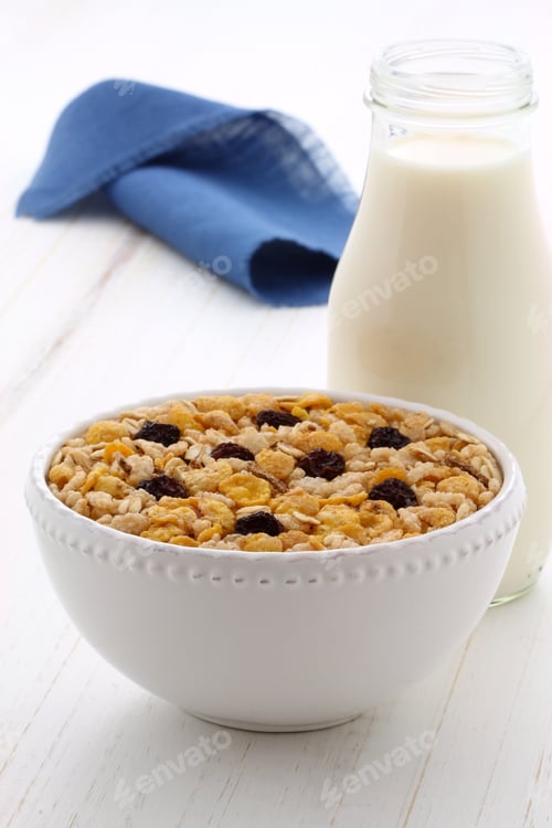 Preview: Delicious And Nutritious Breakfast Muesli Or Granola Cereal With Milk On Vintage Styling.