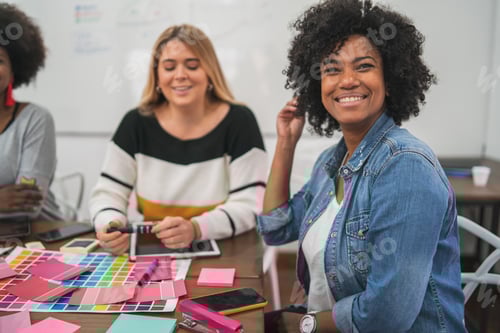 Preview: Young Creative Designers Working In A Project And Discussing New Order Development On Workplace