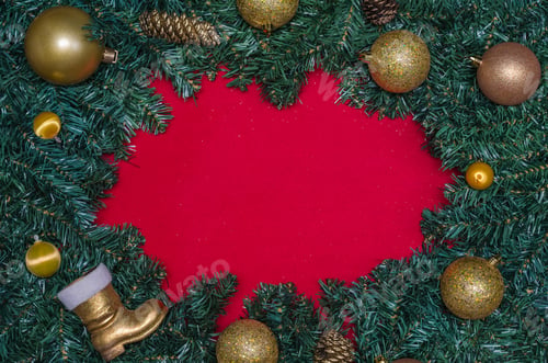 Preview: Background With Christmas Theme, Pine Leaves On The Edges Of Red Paper And Decorative Objects.