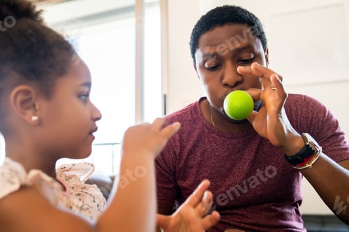 Preview: Daughter And Father Playing Together At Home.