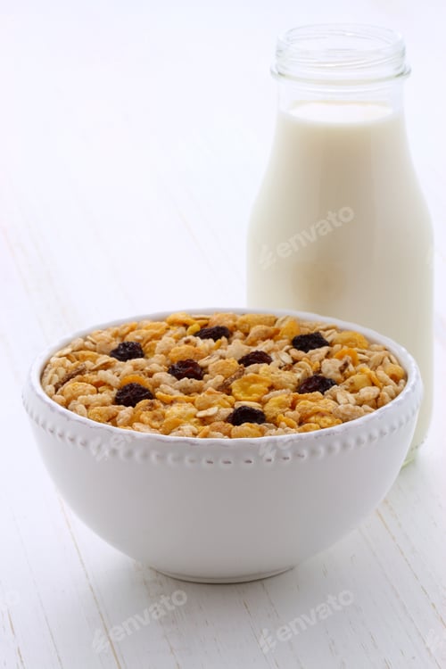 Preview: Delicious And Nutritious Breakfast Muesli Or Granola Cereal With Milk On Vintage Styling.