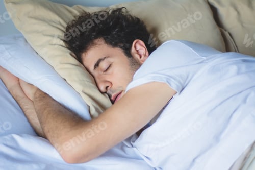 Preview: Close-Up Young Man Sleeping In Bed At Home.