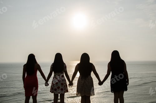Preview: Girls In Front Of The Sunset Holding Hands