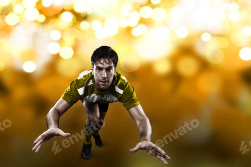 Preview: Rugby Player In A Yellow Uniform Giving A Tackle On A Yellow Lights Background.