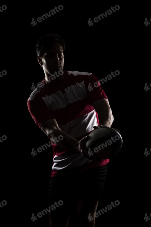 Preview: Silhouette Of A Rugby Player In A Red Uniform. Black Background