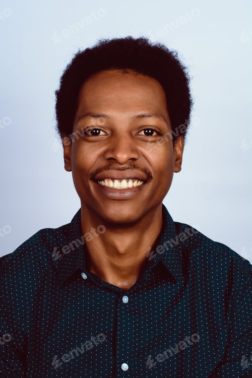 Preview: Portrait Of Afro American Man Looking At Camera On Studio.