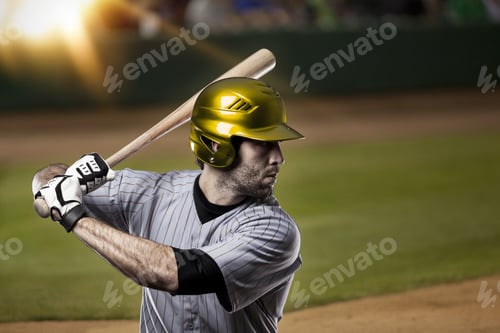 Preview: Baseball Player On A Yellow Uniform On Baseball Stadium.