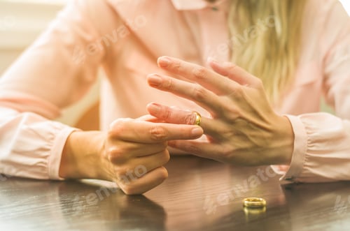 Preview: Great Concept Of Divorce, Ending Of Relationship, Young Woman Pulling Wedding Ring From Finger.