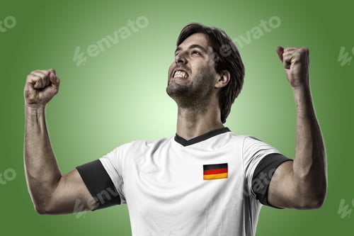 Preview: German Soccer Player, Celebrating On A Green Background.